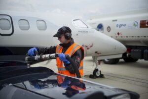 Man filling fuel into a private jet