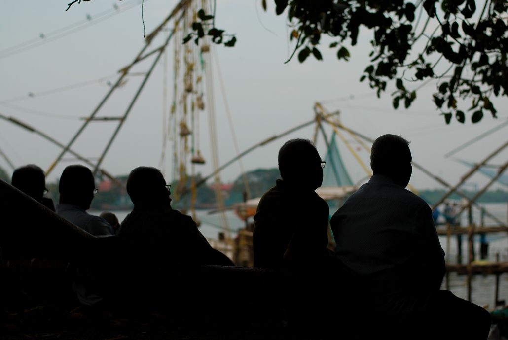 Silhouettes of five men in Kochi India